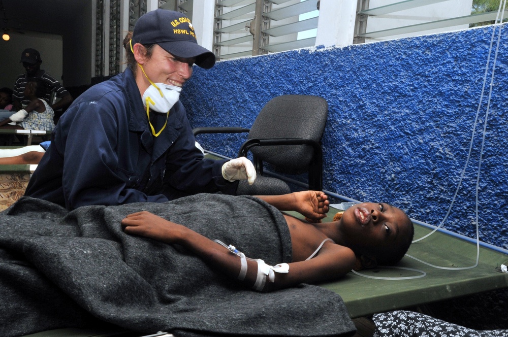 Coast Guard Member Checks Up on Patient