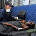 Coast Guard Member Checks Up on Patient