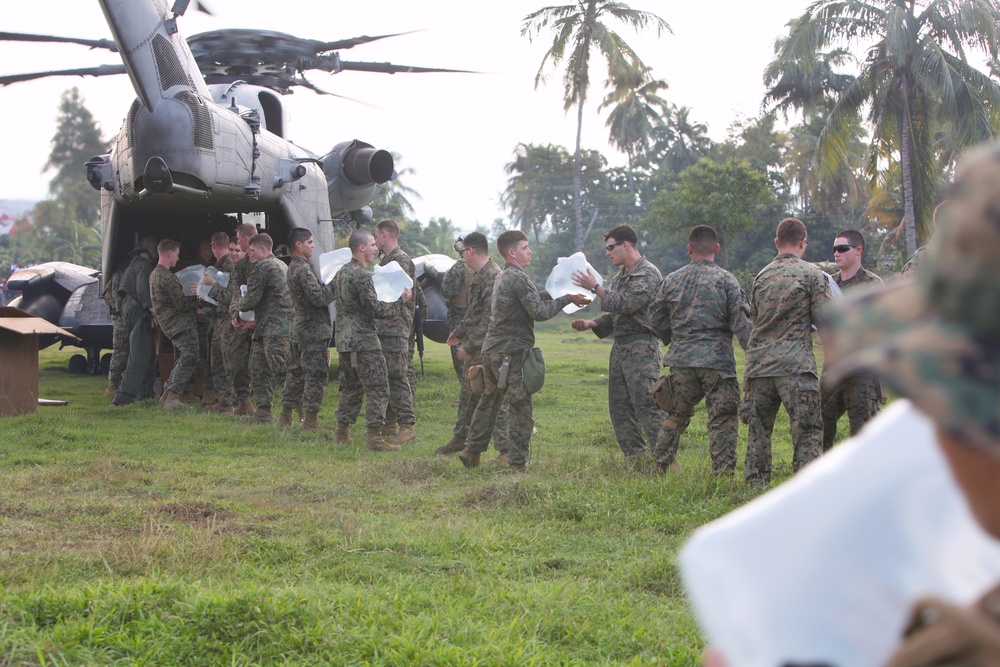 22nd MEU Marines unload supplies for Haiti Relief efforts