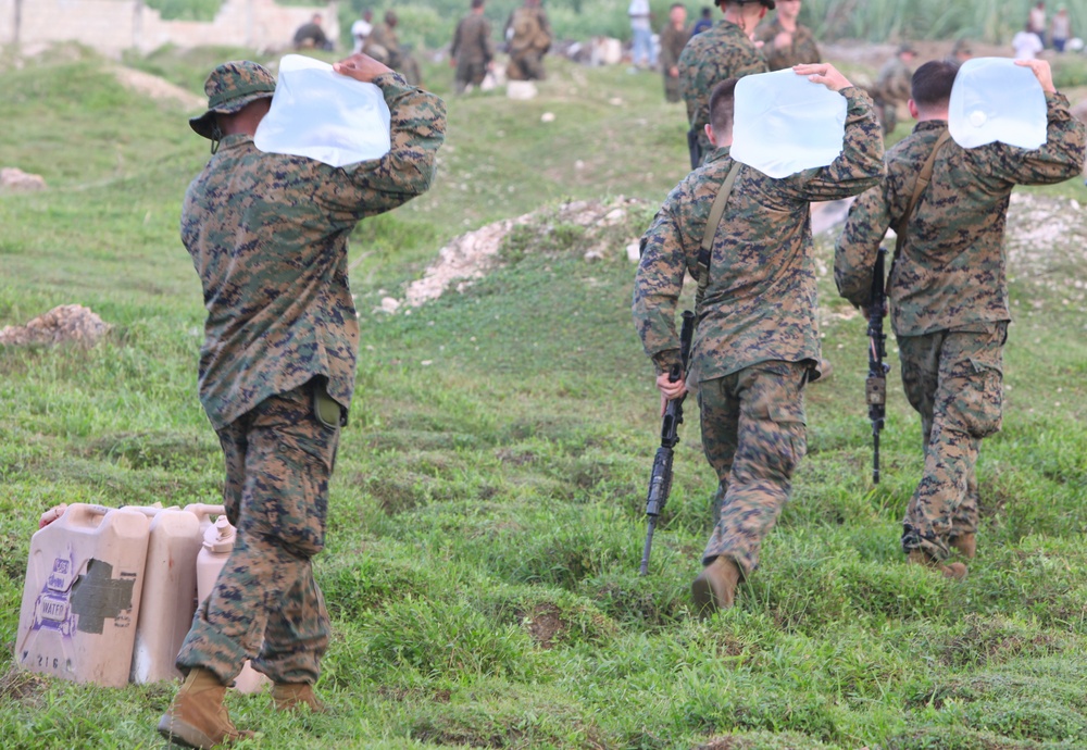 22nd MEU Marines unload supplies for Haiti Relief efforts