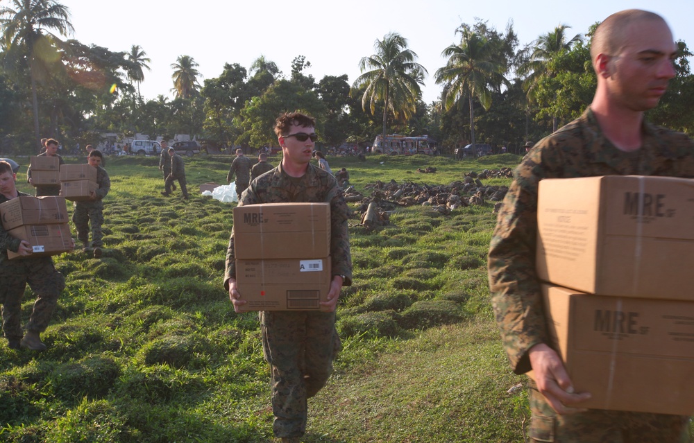 22nd MEU Marines unload supplies for Haiti Relief efforts