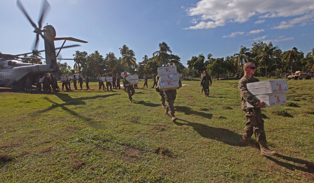 22nd Marine Expeditionary Unit, deliver ready-to-eat rations with a CH-53E Super Stallion