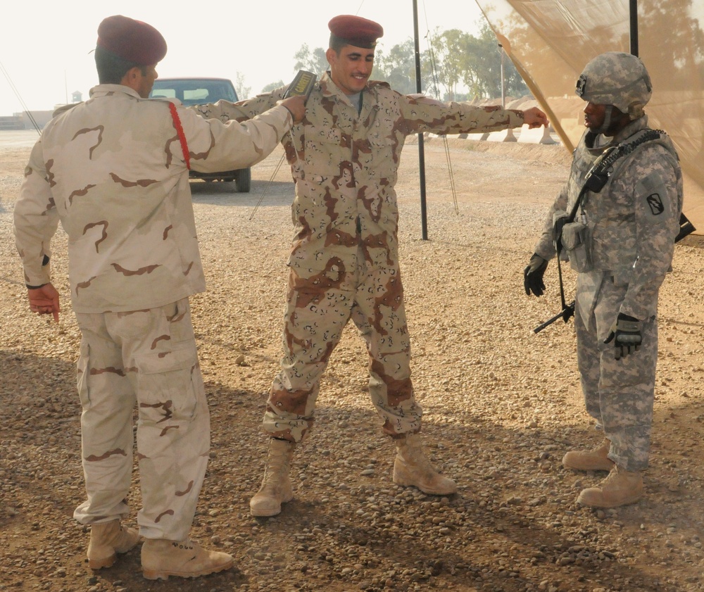 Providers teach Iraqi army check point search procedures