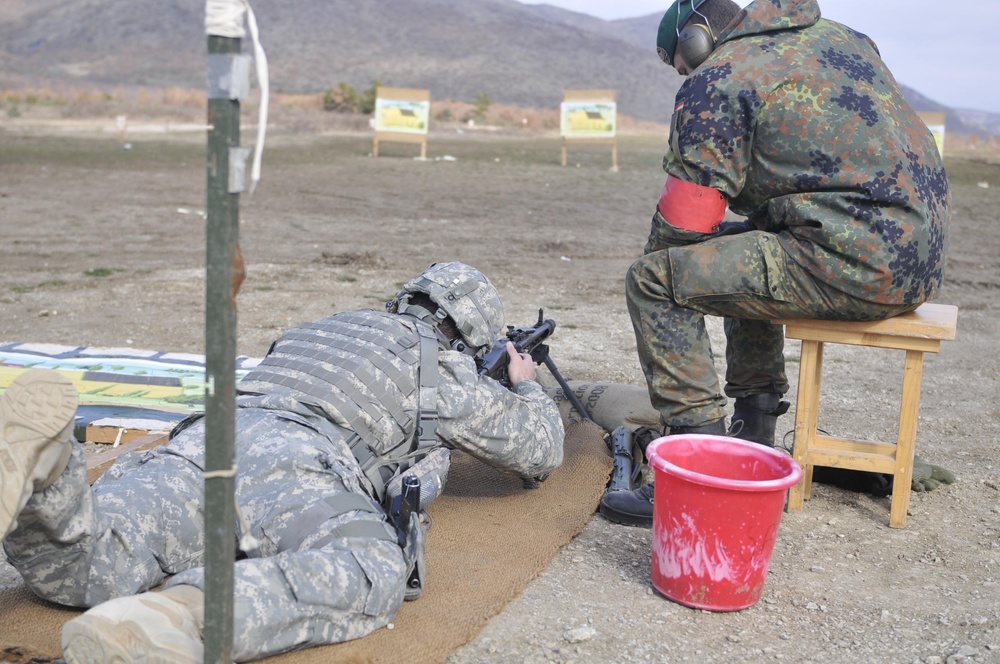 U.S. and German Kosovo Force Soldiers join to earn the 'Schutzenschnur' shooting badge