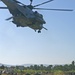 Marine Heavy Helicopter Squadron 461 (Reinforced) as it lifts off after it delivered food and water