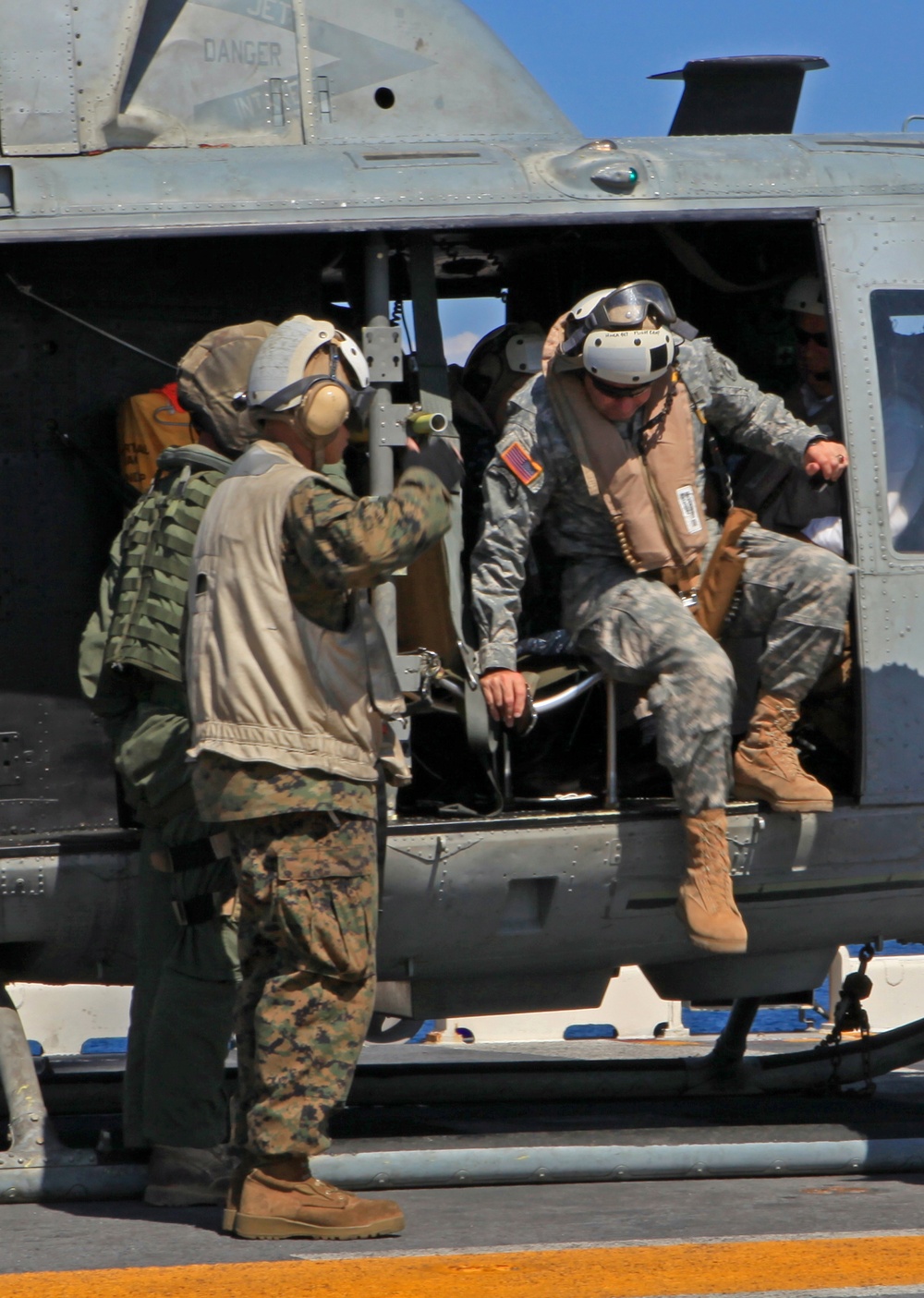 Sailors of USS Bataan stand-by as Lt. General Ken Keen, Joint Task Force Haiti commander, arrives