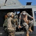 Sailors of USS Bataan stand-by as Lt. General Ken Keen, Joint Task Force Haiti commander, arrives