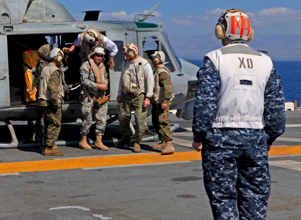 Sailors of USS Bataan stand-by as Lt. General Ken Keen, Joint Task Force Haiti commander, arrives