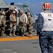 Sailors of USS Bataan stand-by as Lt. General Ken Keen, Joint Task Force Haiti commander, arrives