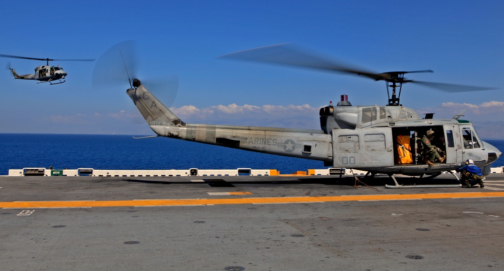 Sailors of USS Bataan stand-by as Lt. General Ken Keen, Joint Task Force Haiti commander, arrives