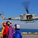 Sailors of USS Bataan stand-by as Lt. General Ken Keen, Joint Task Force Haiti commander, arrives