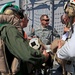 Sailors of USS Bataan stand-by as Lt. General Ken Keen, Joint Task Force Haiti commander, arrives