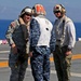 Sailors of USS Bataan stand-by as Lt. General Ken Keen, Joint Task Force Haiti commander, arrives