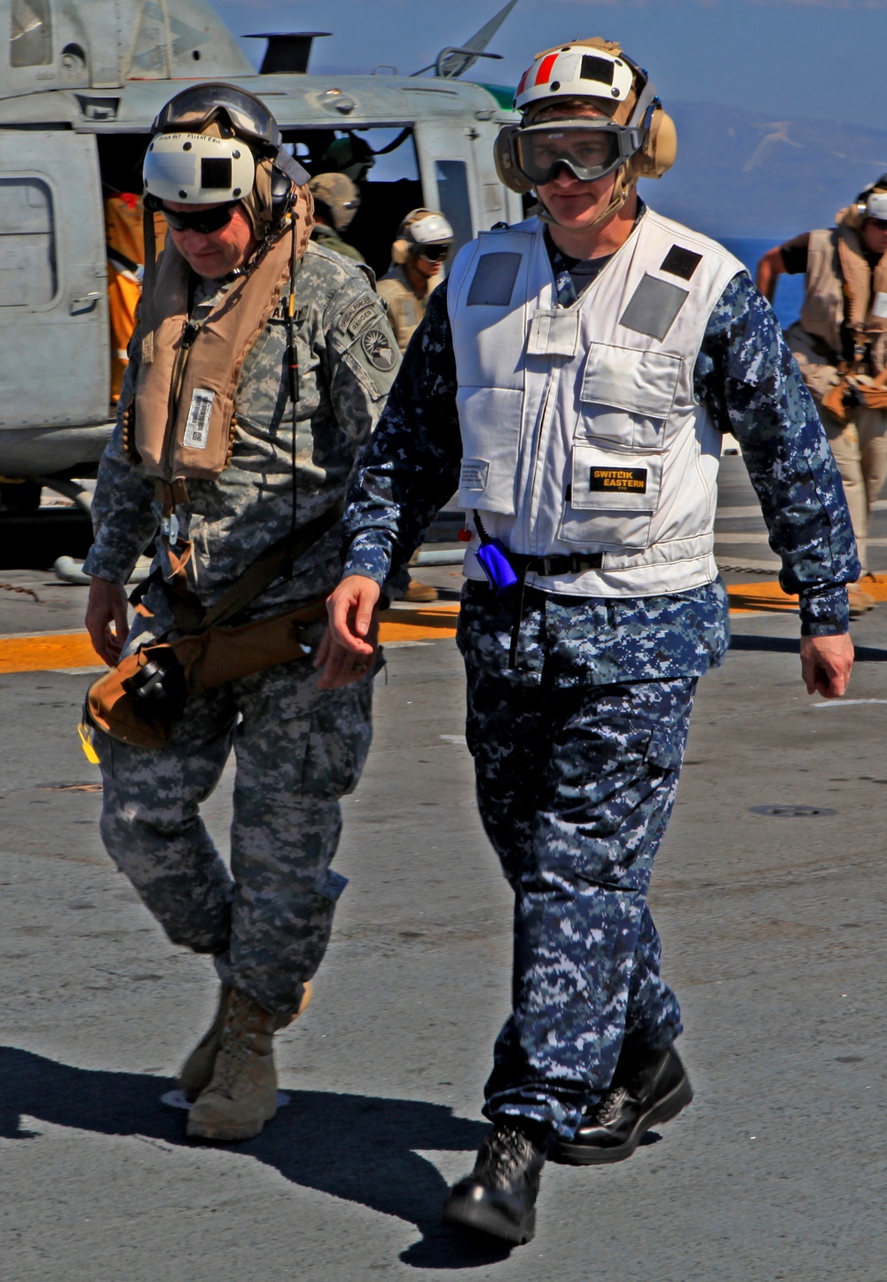 Sailors of USS Bataan stand-by as Lt. General Ken Keen, Joint Task Force Haiti commander, arrives