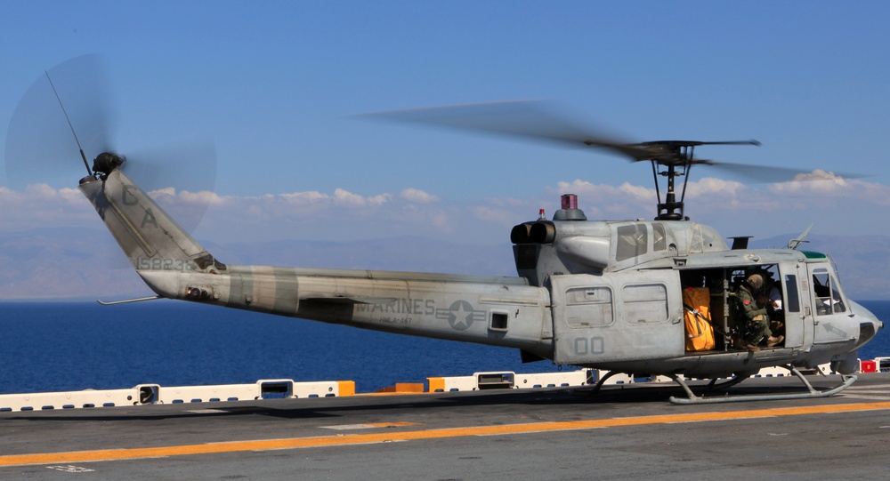 Sailors of USS Bataan stand-by as Lt. General Ken Keen, Joint Task Force Haiti commander, arrives