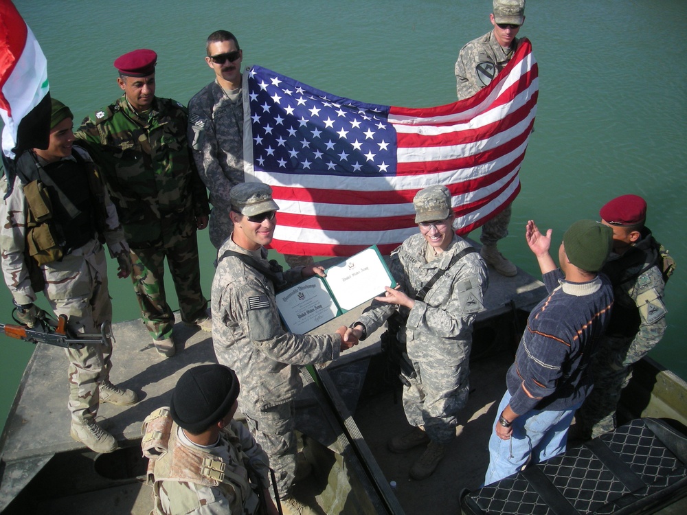 Soldier celebrates re-enlistment with Iraqi 'Swamp Cops'