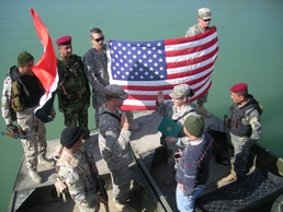 Soldier celebrates re-enlistment with Iraqi 'Swamp Cops'