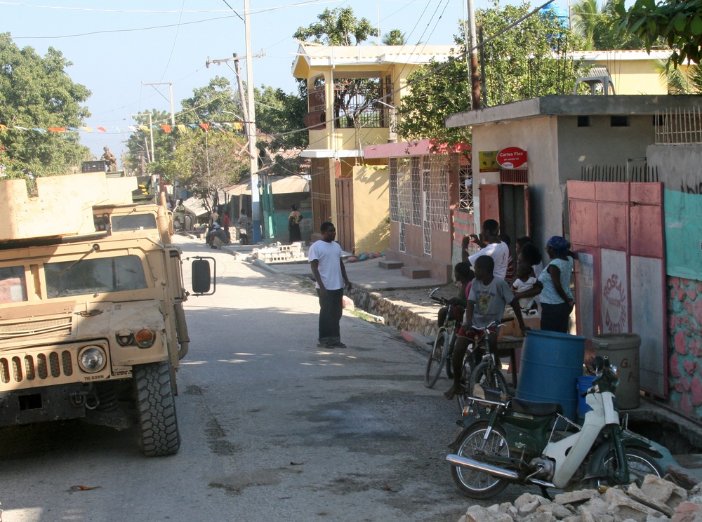22nd Marine Expeditionary Unit, travels through Grand Goave en route to Petit Goave, Haiti, Jan. 24.