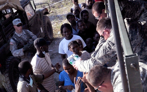 2-319th, Black Falcons, Deliver Much Needed Food and Water in Port-au-Prince