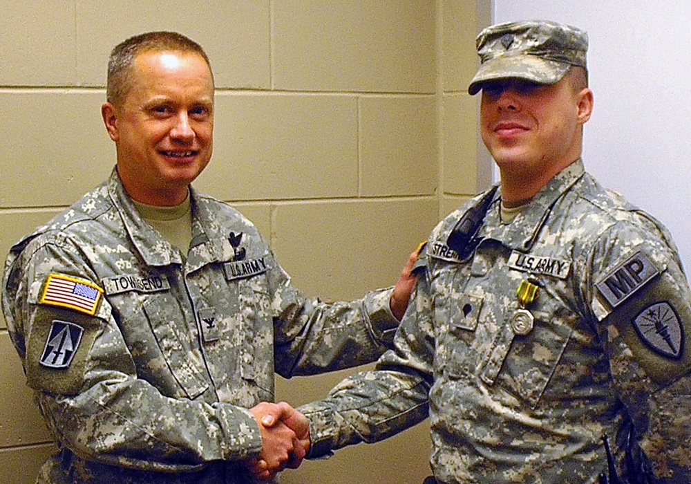 Military policeman saves civilian contractor's life