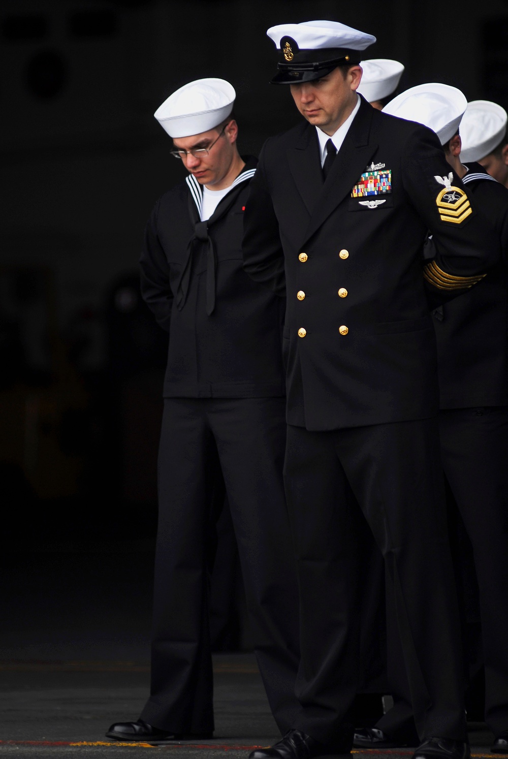 Sailors perform burial-at-sea