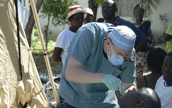 Navy dentist extracts tooth
