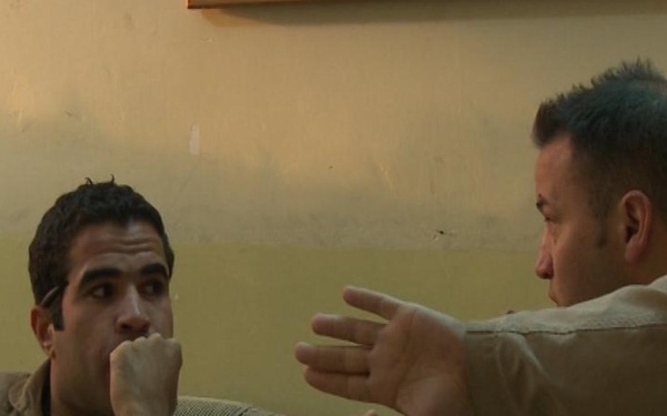 Iraqi gunners look out from above