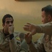 Iraqi gunners look out from above