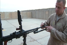 Iraqi gunners look out from above