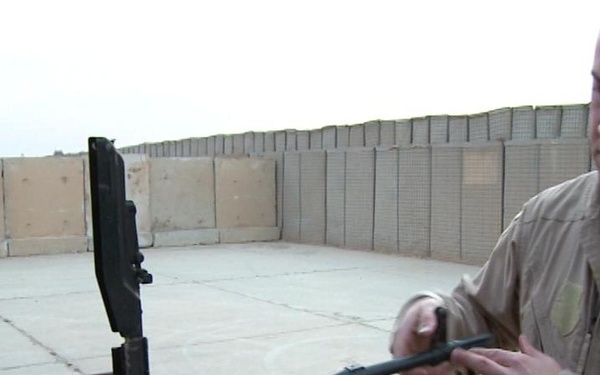 Iraqi gunners look out from above