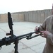 Iraqi gunners look out from above