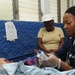 Petty Officer 2nd Class Kisha Wright Treats Patients