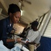 Petty Officer 2nd Class Kisha Wright Treats Patients