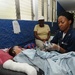 Petty Officer 2nd Class Kisha Wright Treats Patients
