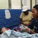 Petty Officer 2nd Class Kisha Wright Treats Patients