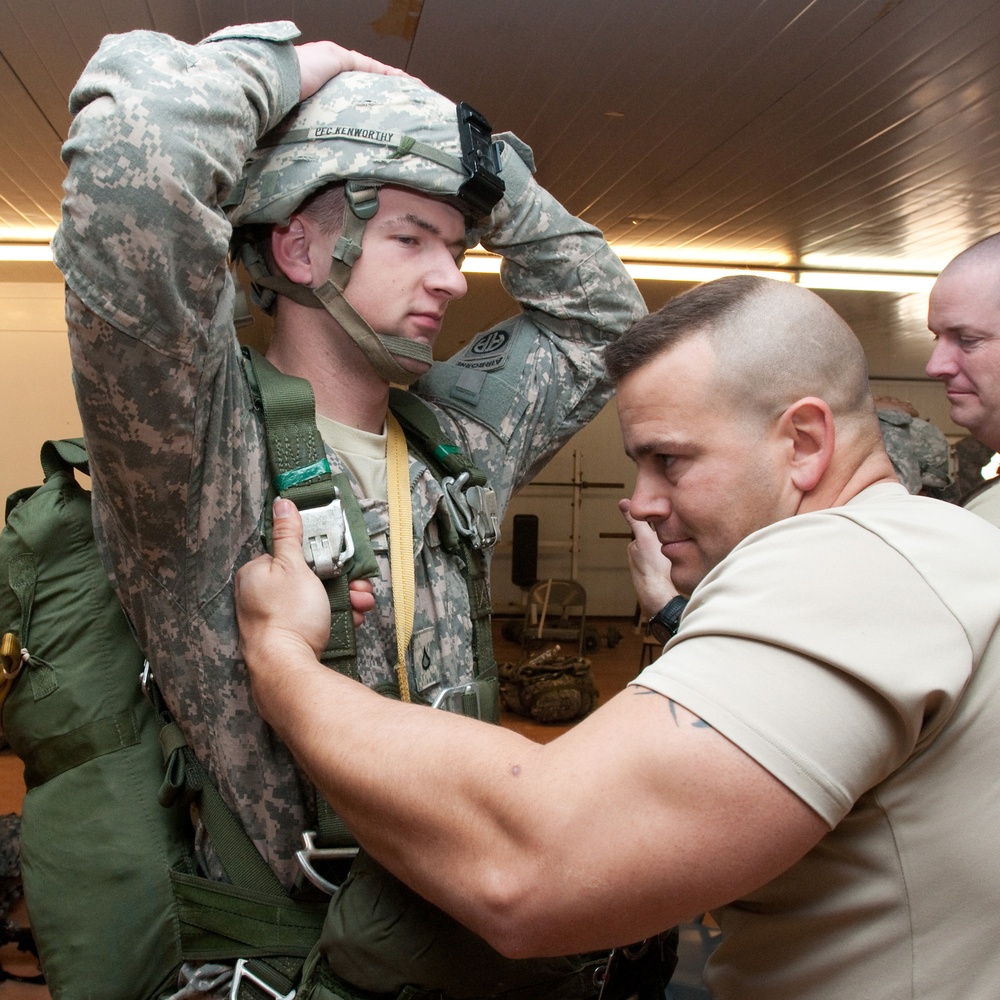 Instructors Coach Deployed Jumpmasters for Upcoming Parachute Jump