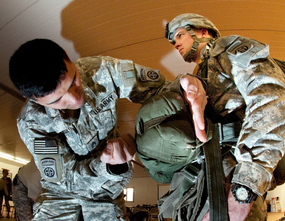 Instructors Coach Deployed Jumpmasters for Upcoming Parachute Jump