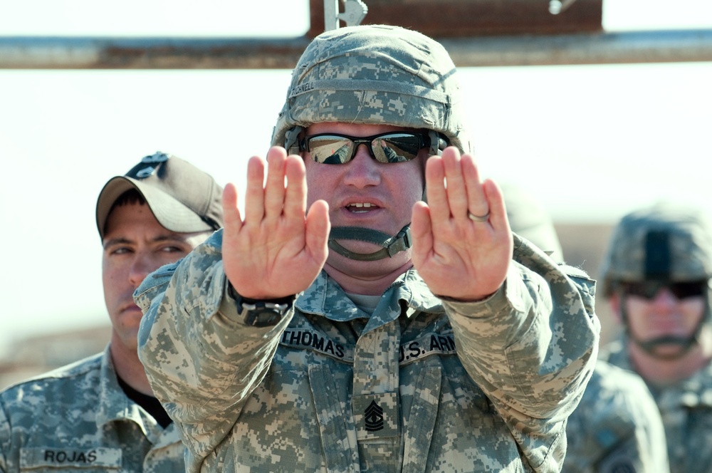 Instructors Coach Deployed Jumpmasters for Upcoming Parachute Jump