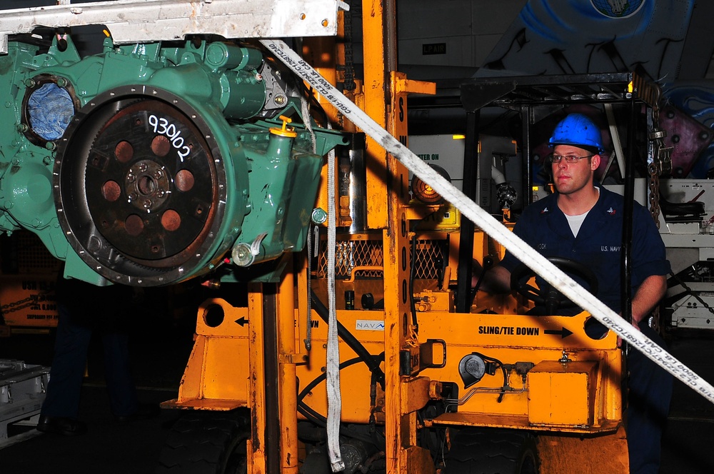 Sailor operates a forklift