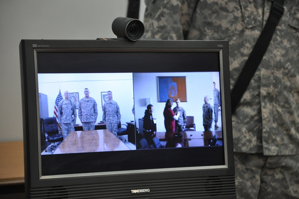 Deployed Soldiers share promotion ceremony with family members