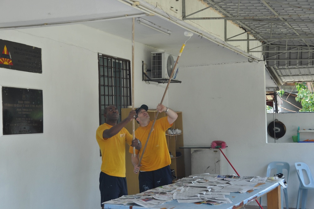 Sailors work in Malaysia
