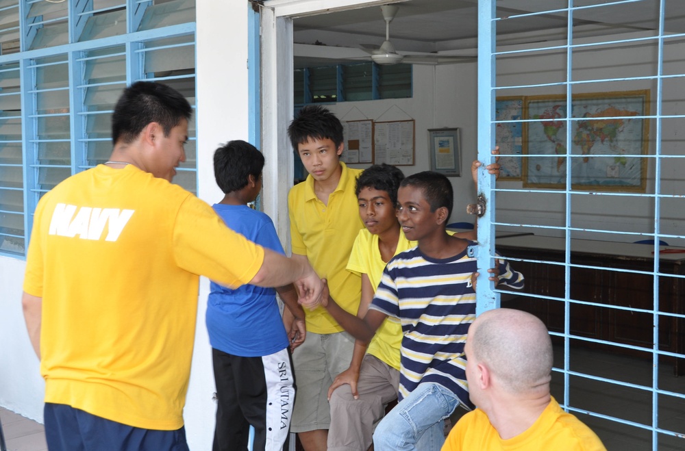 Sailors work in Malaysia