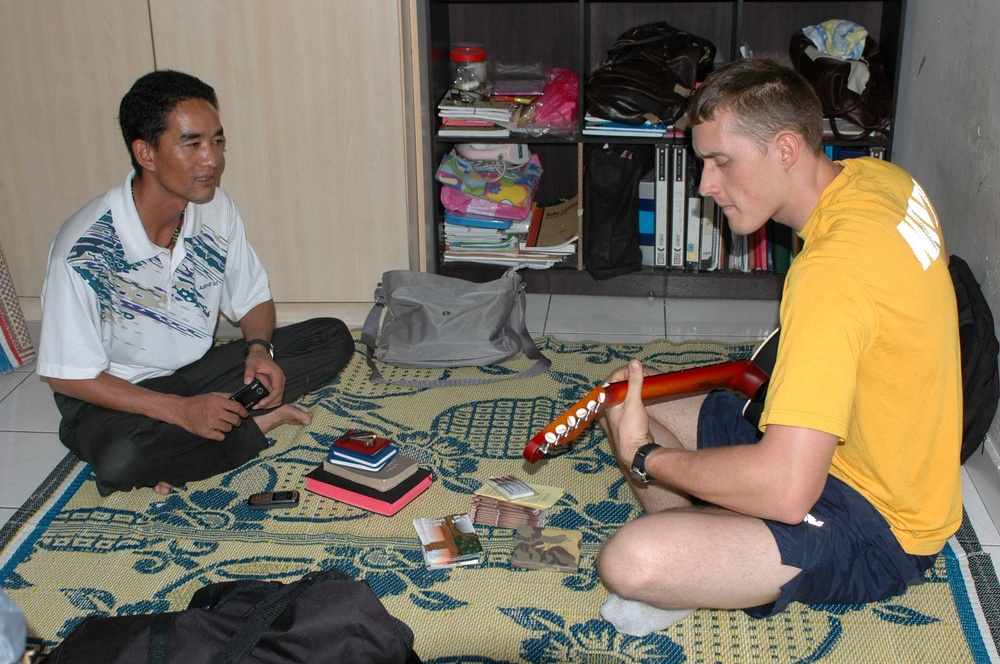 Sailors work in Malaysia