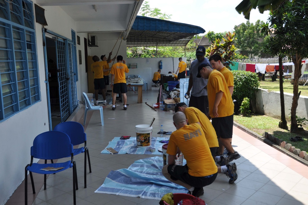 Sailors work in Malaysia