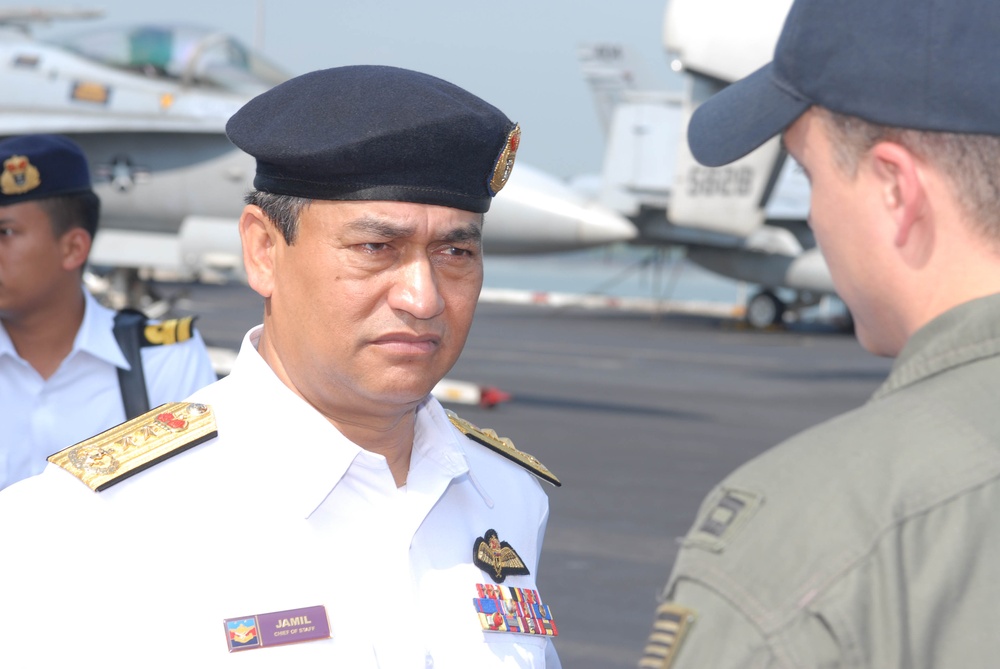 Sailors work in Malaysia