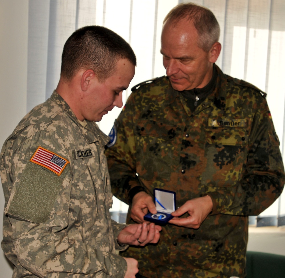 Kosovo Forces commander receives briefing from Multi-National Battle Group - East Liaison and Monitoring Team