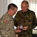 Kosovo Forces commander receives briefing from Multi-National Battle Group - East Liaison and Monitoring Team