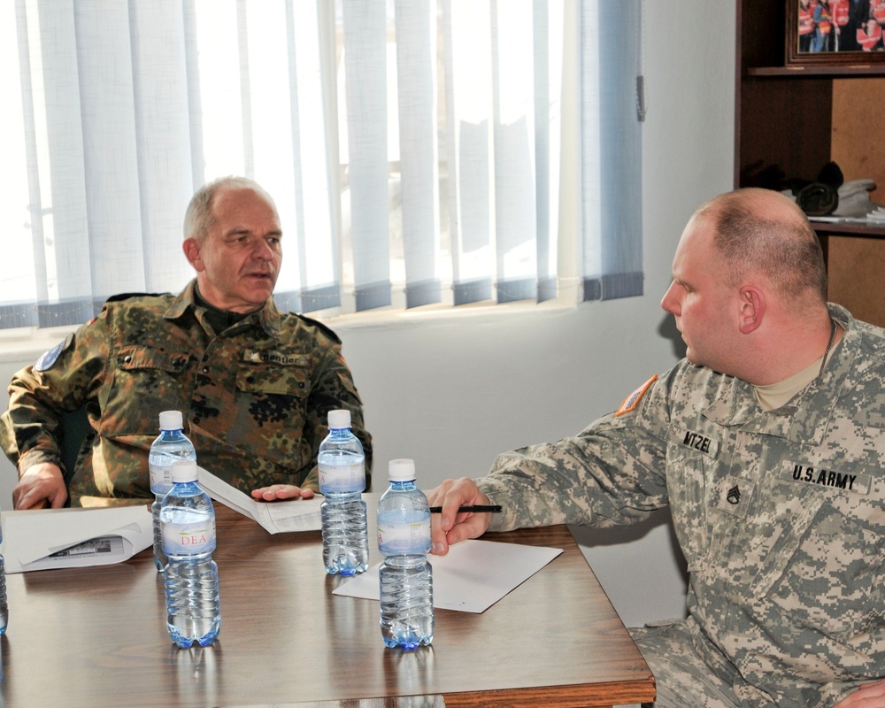 Kosovo Forces commander receives briefing from Multi-National Battle Group - East Liaison and Monitoring Team
