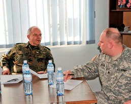 Kosovo Forces commander receives briefing from Multi-National Battle Group - East Liaison and Monitoring Team