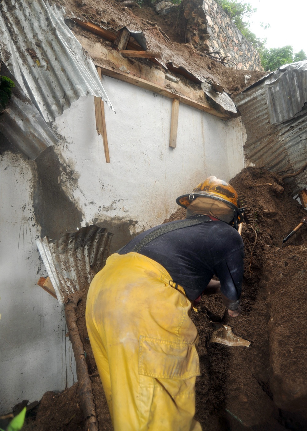 Haitian firefighters look for survivors